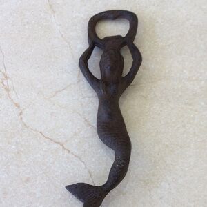 Antique Mermaid Bottle Opener made of cast iron.